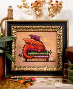 Book Dragon cross stitch pattern by NeedleLot Designs, a dragon with books