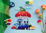 Mushroom Badger cross stitch pattern by NeedleLot Designs, a badger under a toadstool
