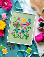 Hummingbird cross stitch pattern by NeedleLot Designs, a hummingbird among flowers