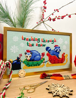 Trashing Through The Snow cross stitch pattern by NeedleLot Designs, raccoons in a sleigh in the snow