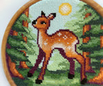 Fawn in the Forest cross stitch pattern by NeedleLot Designs, a fawn in a ray of sunlight