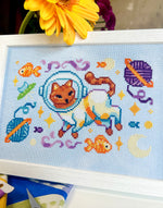 Catstronaut cross stitch pattern by NeedleLot Designs, a cat in a space suit