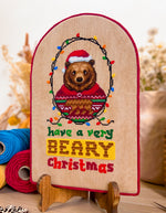 Have A Very Beary Christmas cross stitch pattern by NeedleLot Designs, a bear celebrating Christmas