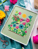 Hummingbird cross stitch pattern by NeedleLot Designs, a hummingbird among flowers
