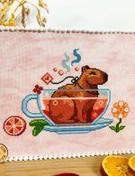 Capybara Tea Time cross stitch pattern by NeedleLot Designs, a capybara in a hot bath