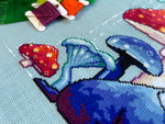 Mushroom Badger cross stitch pattern by NeedleLot Designs, a badger under a toadstool
