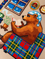 Reading by the Fire cross stitch pattern by NeedleLot Designs, a bear reading by the fire