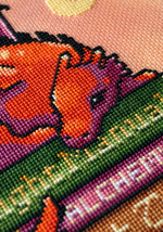 Book Dragon cross stitch pattern by NeedleLot Designs, a dragon with books
