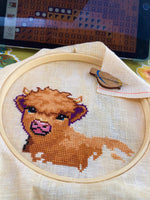 Wee Highland Calf cross stitch pattern by NeedleLot Designs, a highland calf among flowers