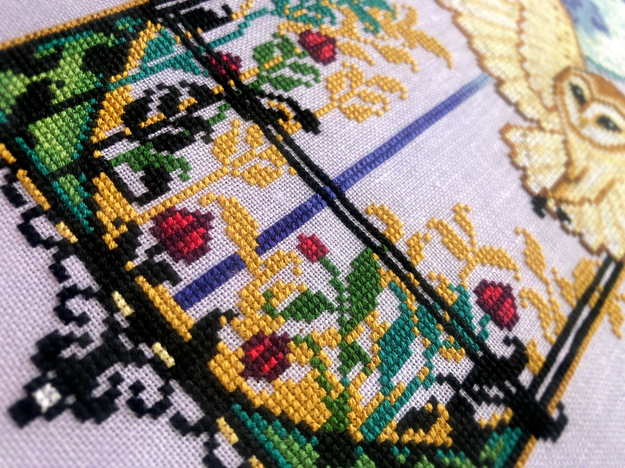 Extreme closeup of bottom half of the scene, with lots of vegetation. There are several plants and flower bulbs here, in lots of different colors. Flower bulbs are red with garnet outlines. There are leaves, these are gold, green, teal and black.
