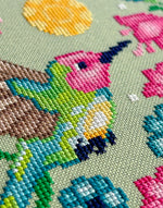 Hummingbird cross stitch pattern by NeedleLot Designs, a hummingbird among flowers