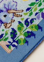Triceratops cross stitch pattern by NeedleLot Designs, a triceratops in a prehistoric jungle